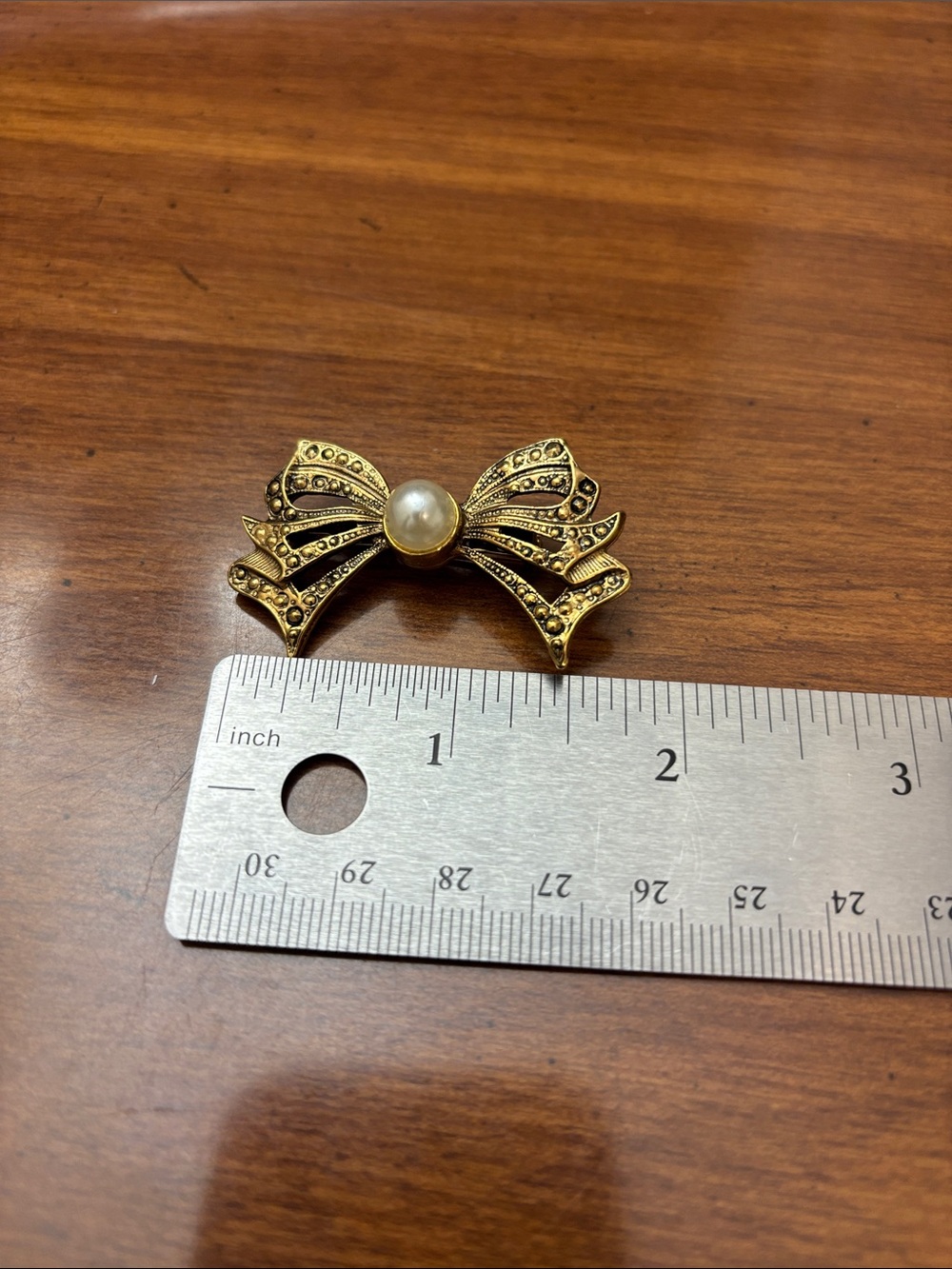 1928 Gold-Tone Bow Brooch with Pearl Center